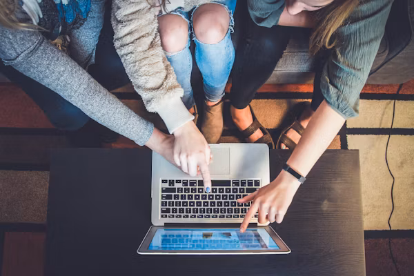 Educators looking at a laptop